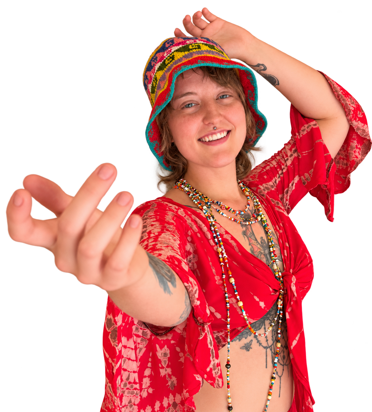 Pixie Loc Wizard, a Phoenix hairstylist, smiling in a red outfit and colorful hat
